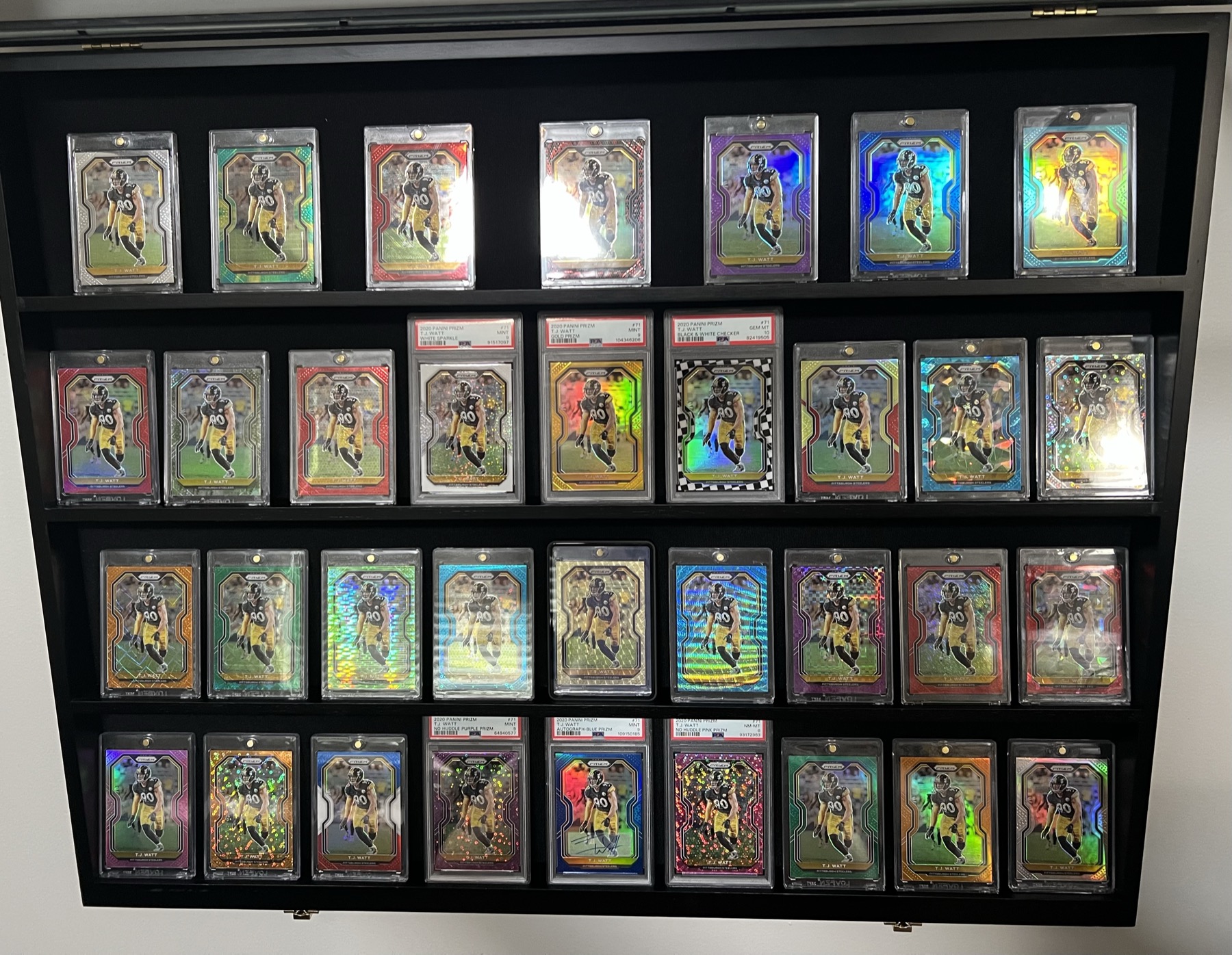Display case holding 36 parallels of the 2020 Prizm T.J. Watt